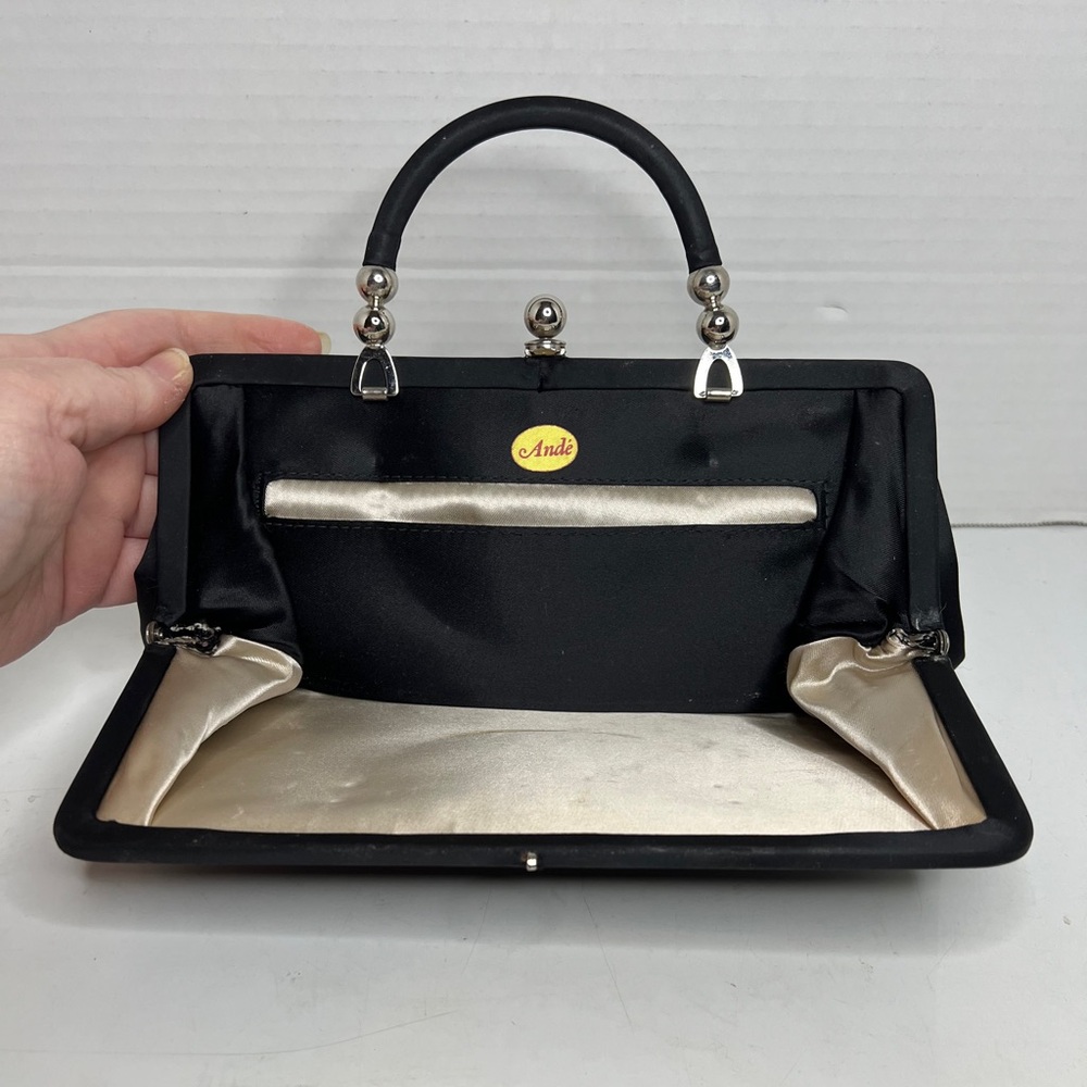Vintage Black Andé Brand Hide Away Strap Clutch Handbag with Rose Gold Interior